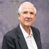 John E. Don Carlos